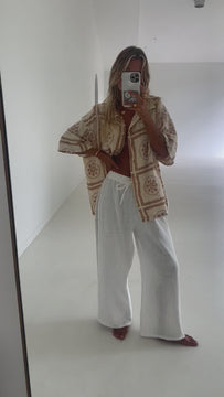 white cotton lace pant and artist print shirt