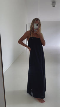 model wearing cotton black maxi dress with thin straps
