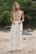 Womens tan cotton tie dye bodysuit, styled with cream pant, front view