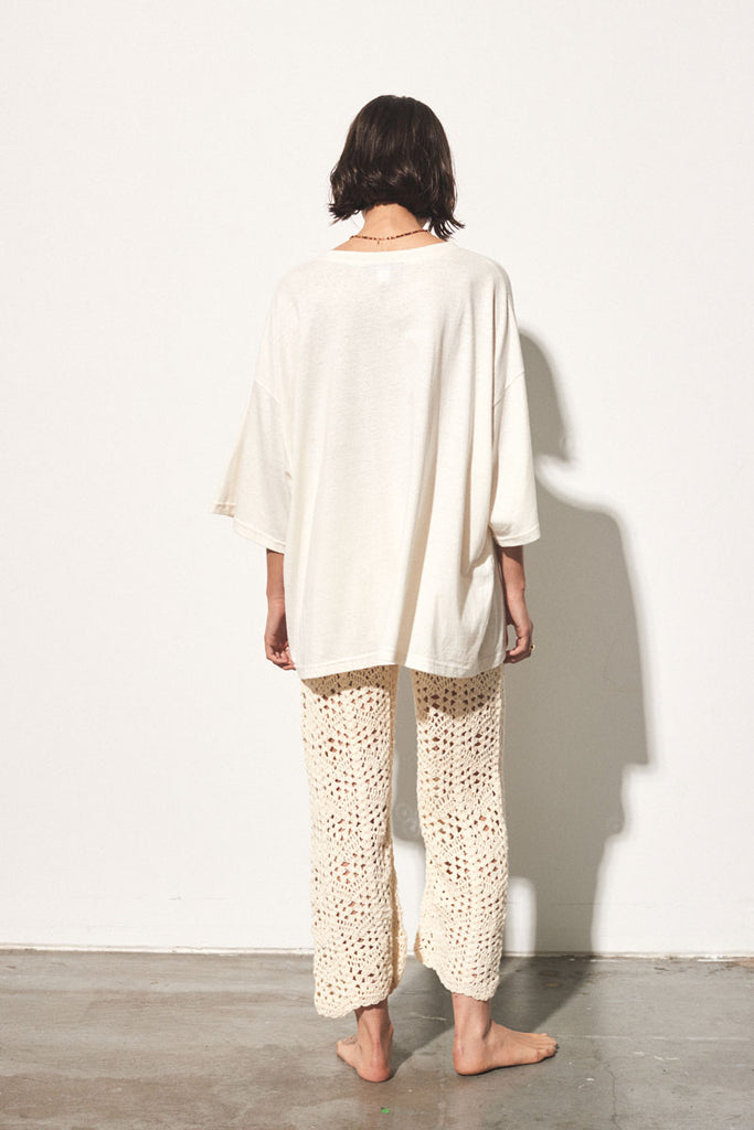 oversized cream tee with red graphic drawing