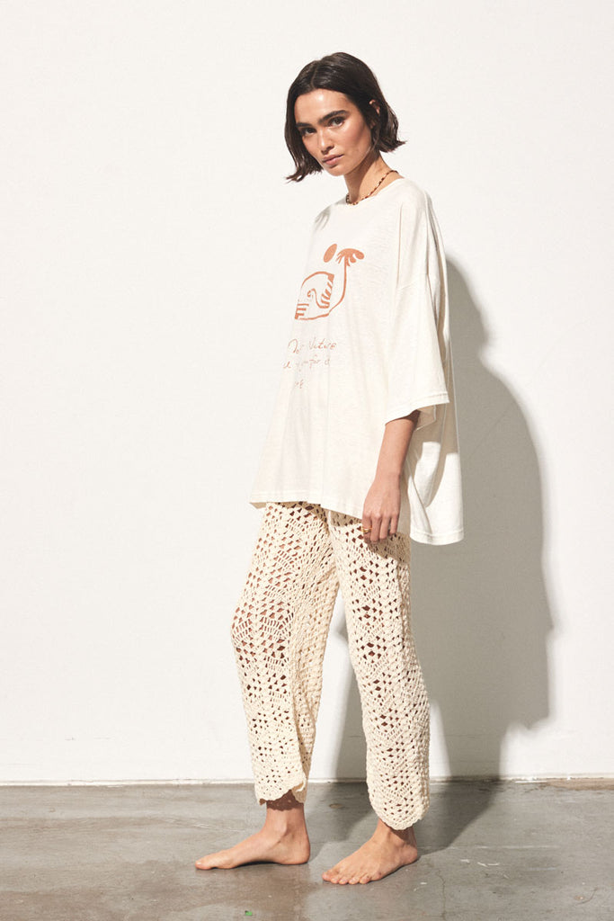 ladies cream shirt with red graphic pattern